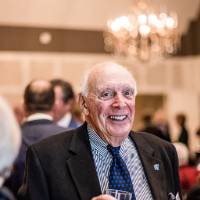 Raleigh J. Finkelstein talking with guests.